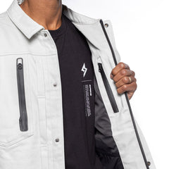 Person wearing a Super 73 white jacket with black accents and a black shirt with a Super73 Apparel Logo