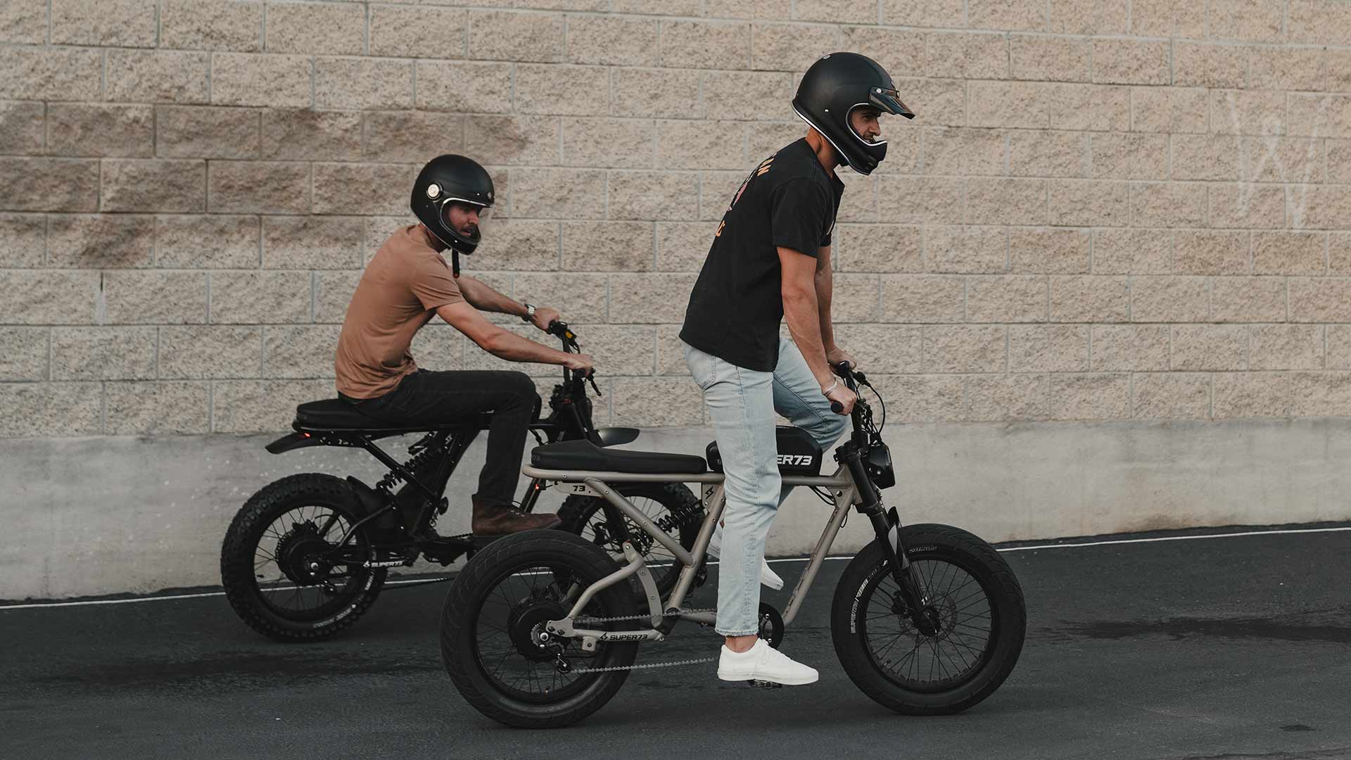 Two men riding Super73 ebikes